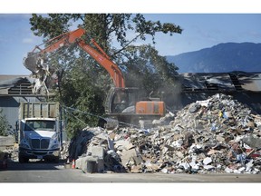Work continues outside Bright Sky Disposal on 116 Avenue in Surrey B.C. on August 24, 2016.