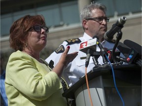 Surrey, BC: April 08, 2016 -- Surrey, BC mayor Linda Hepner (left) and the RCMP announce measures to fight a spate of shootings in the city during a press conference Friday, April 8, 2016. Pictured is RCMP assistant commissioner Bill Fordy (right).