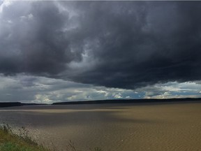 A storm approaches from the North as Kevin Vallely and his family make camp in Fort Good Hope.