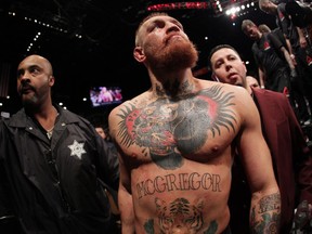 Conor McGregor exits the Octagon after his fight against Nate Diaz in their welterweight bout during the UFC 196 at the MGM Grand Garden Arena on March 5, 2016 in Las Vegas, Nevada.