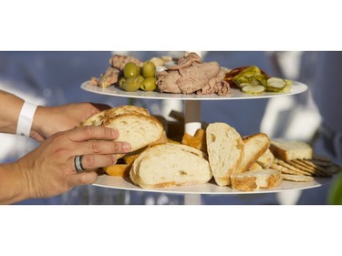 Food is placed out at Le Diner en Blanc at Concord Pacific Place Vancouver, August 18 2016.