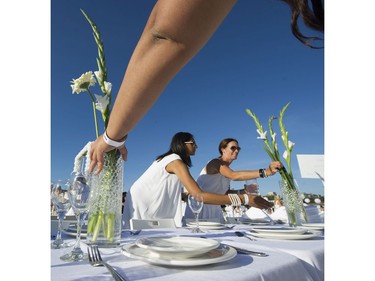 Tables are set for those attending Le Diner en Blanc at Concord Pacific Place Vancouver, August 18 2016.