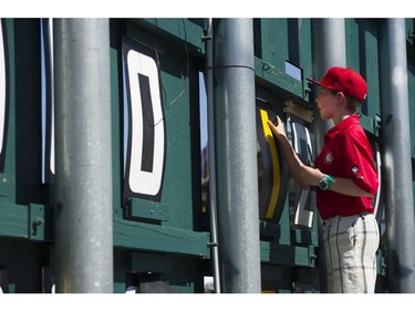 Henry Bull changes  the numbers for hits on the scoreboard for a Vancouver Canadians game at Nat Bailey stadium  Vancouver, August 19 2016.