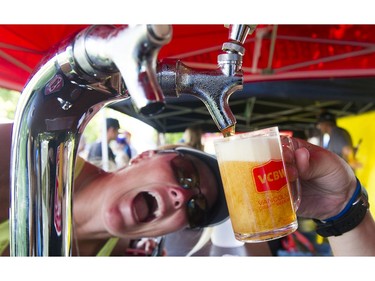 Cali Parkin waits for a taste of the 100 Meridian beer from Mill Street brewery in the Craft Beer Fest at 2016 Fair at thePNE Vancouver, August 20 2016.