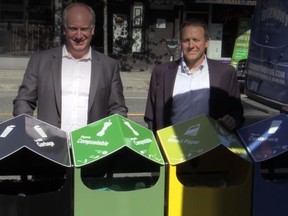 Allen Langdon, managing director of Multi-Material B.C., left, and Chris Underwood, manager, solid waste strategic services for the City of Vancouver, with the new street recycling bins.