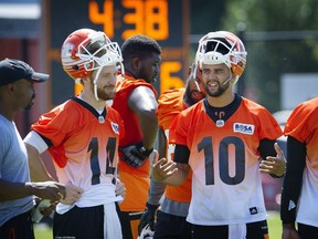 Vancouver  B.C. August 1, 2016  Two is better than one-- B.C. Lions Quarter back Jonathon Jennings 10, (centre) holds court with Tavis Lulay 14 and team mates at the B.C. Lions Training facility in Surrey  on  August 1, 2016 , 2016.       Mark van Manen/ PNG Staff photographer   see Mike Beamish / Iain MacIntyre Province /Vancouver Sun/   Sports   Province /stories  and Web.  00044337A [PNG Merlin Archive]