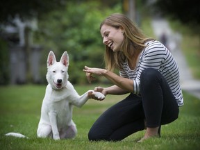 Marisa Nielsen gives some loving guidance to Evie, her deaf, husky-German shepherd cross puppy. Nielsen, who grew up with two deaf parents and whose fiance is a sign-language interpreter, have adopted Evie and are training her via sign language. 'She barks when she wants to play,’ says Nielsen. 'She has no idea how loud she sounds.'