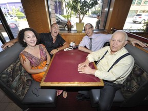 Tops owner Steve Taraviras, right, with his children, from left, Helen, Chris and George inside the Kingsway restaurant he's run since 1972.