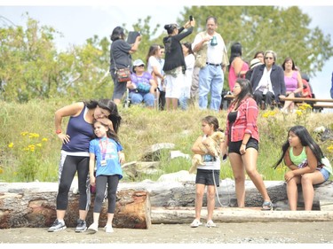 Crowds gather to watch the launching of the Musqueam journey canoe.