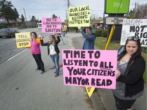 Maple Ridge residents rallied outside the city's Quality Inn in March after the B.C. government wanted to turn it into a homeless shelter. Now business owners are unhappy about a plan to build a permanent shelter in a vacant lot on the Lougheed Highway.