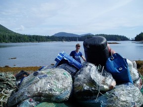In this undated photo, volunteers clean up the beach at Sea Otter Cove, located near the northwestern end of Vancouver Island. Living Oceans is leading a number of groups in what is billed as the biggest marine cleanup in Canadian history.