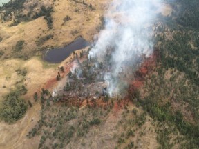 Crews are mopping up the remnants of a wildfire that broke out Saturday afternoon southwest of Vernon. An evacuation order for about 45 homes has been rescinded.