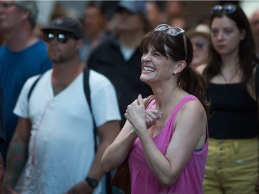 A woman reacts during a viewing party for the final stop in Kingston, Ont., of a 10-city national concert tour by The Tragically Hip, in Vancouver, B.C., on Saturday August 20, 2016. Lead singer Gord Downie announced earlier this year that he was diagnosed with an incurable form of brain cancer.