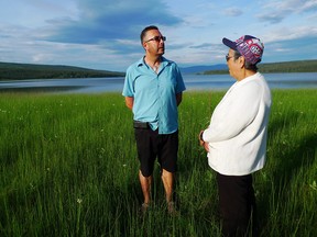 Tlingit band councillor Duane Aucoin and elder Madeleine Jackson stand on the banks of Teslin Lake on July 18, 2016, near where her family used to hold its traditional fish camp. With the continued poor health of the world's biggest and longest run of Chinook salmon, the Teslin Tlingit have reduced their harvest from about 1,000 to 40, leaving a hole in their culture no one quite knows how to replace.
