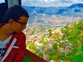 Visitor from Bogota views Medellin from gondola. Tom Gies