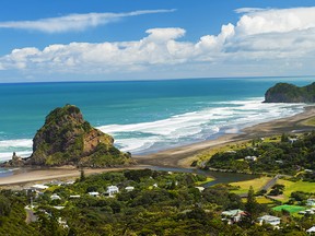 Beautiful Piha beach near Auckland with a mighty Lion Rock, New Zealand