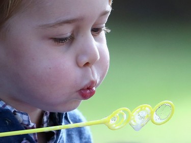 Prince George of Cambridge plays with bubbles at a children's party for Military families during the Royal Tour of Canada on September 29, 2016 in Victoria, Canada. Prince William, Duke of Cambridge, Catherine, Duchess of Cambridge, Prince George and Princess Charlotte are visiting Canada as part of an eight day visit to the country taking in areas such as Bella Bella, Whitehorse and Kelowna  (Photo by Chris Jackson - Pool/Getty Images) ORG XMIT: 672273767