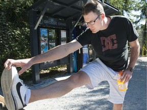 Kristian Inglehart stretches in preparation to climb the Grouse Grind.