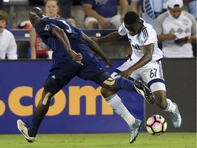 Vancouver Whitecaps forward Alphonso Davies (67) moves against Sporting Kansas City defender Ike Opara (3) during the first half of a CONCACAF soccer match in Kansas City, Kan., Tuesday, Sept. 13, 2016.