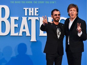 Britain singer-songwriter Paul McCartney (R) and musician Ringo Starr (L) arriving to attend a special screening of the film The Beatles Eight Days A Week: The Touring Years in London on Sept. 15.