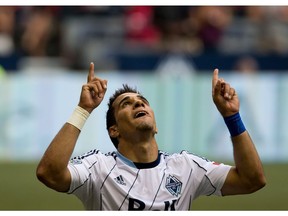 Vancouver Whitecaps' Camilo Sanvezzo, of Brazil, celebrates his second goal against the Chicago Fire during the second half of an MLS soccer game in Vancouver, B.C., on Sunday July 14, 2013.