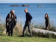 The Duke and Duchess of Cambridge, walk with Peter Lantin, left, President of the Council of Haida Nation, in Haida Gwaii, British Columbia on September 30, 2016. /