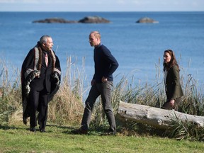 The Duke and Duchess of Cambridge, walk with Peter Lantin, left, President of the Council of Haida Nation, in Haida Gwaii, British Columbia on September 30, 2016. /