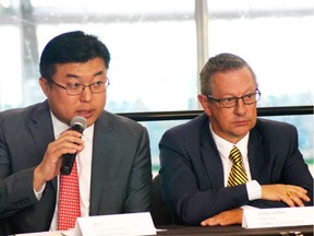 Canada China Sports Foundation members Victor Tsao and Arthur Griffiths (right) speak at the announcement of the women's hockey tournament, set for Vancouver in October, featuring China's national women's team.