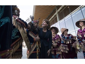 British Columbia Premier Christy Clark speaks to members of the Wolf Pack dance group following an event in Vancouver, Tuesday, Sept. 6, 2016. The premier announced the government and BC Ferries are joining to bring a direct ferry service between Port Hardy and Bella Coola to support Aboriginal tourism and the mid-coast economy.