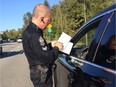 COQUITLAM, B.C. (Sept. 28, 2016) -- Cpl. Grant Gottgetreu adds one more to the 2,000-plus vehicles he's had impounded for excessive speeding on Wednesday morning along David Avenue in Coquitlam. (Submitted photo: Grant Gottgetreu) [PNG Merlin Archive]