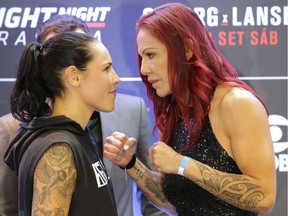 Brazil's Cristiane Justino, known as "Cris Cyborg," right, and Sweden's Lina Lansberg pose for photos at an event promoting an upcoming UFC Fight Night in Brasilia, Brazil, Thursday, Sept. 22, 2016. Their fight is set for Saturday, Sept. 24.