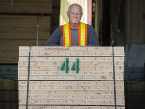 Russ Camerson, president of the Independent Wood Processors association, with value added wood products at Leslie Forest Products in Delta.