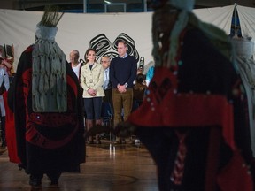 Prince William, the Duke of Cambridge, and Kate, the Duchess of Cambridge, watch as members of the Heiltsuk First Nation dance during a welcoming ceremony in Bella Bella on Monday.