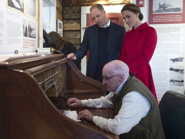 The Duke and Duchess of Cambridge look on as Doug Bell sends a message at the MacBride Museum of Yukon History in Whitehorse, Yukon, Wednesday, Sept. 28, 2016.