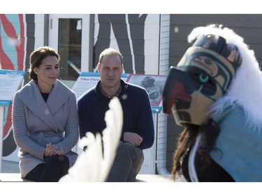 Prince William and his wife Kate, the Duke and Duchess of Cambridge, watch native youth dancers perform during a welcoming ceremony in Carcross, Yukon, Wednesday, Sept. 28, 2016.