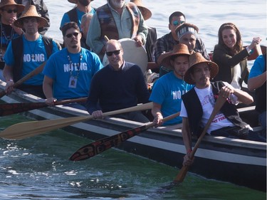 The Duke and Duchess of Cambridge paddle with a group in a traditional Haida canoe in the waters of Haida Gwaii, Friday, Sept. 30, 2016.