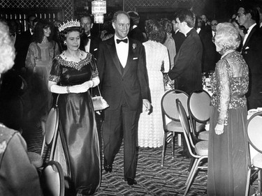 Queen Elizabeth II arrives at a function with Prime Minister Pierre Trudeau during the royal visit in 1983.