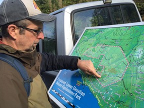 Elphinstone Logging Focus founder Ross Muirhead points to the location of a controversial logging site on the Sunshine Coast.