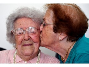 Yvette Florens, 85 years old, kisses her mother, Honorine Rondello, 113, the oldest person in France, Sept. 7. Here in Canada, 25 per cent of the population will be 65 years or older within the next two decades.