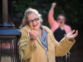 Indigenous trans sex work activist Jamie Lee Hamilton (L) unveils a memorial dedicated to sex workers of the West End community in Vancouver, British Columbia on September 16, 2016.