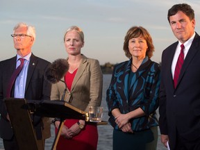 Jim Carr, Minister of Natural Resources, from left to right, Catherine McKenna, Minister of Environment and Climate Change, B.C. Premier Christy Clark and Dominic LeBlanc, Minister of Fisheries, Oceans and the Canadian Coast Guard, listen to a question after the federal government announced approval of the Pacific NorthWest LNG project, at the Sea Island Coast Guard Base in Richmond on Tuesday.