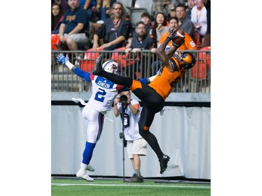 B.C. Lions' Emmanuel Arceneaux, right, makes a reception in the end zone for a touchdown as Montreal Alouettes' Jovon Johnson defends during the first half of a CFL football game in Vancouver, B.C., on Friday September 9, 2016.