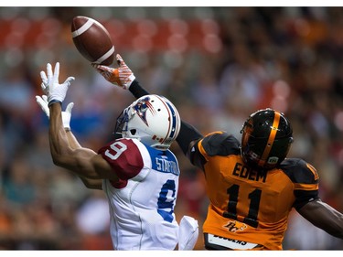 B.C. Lions' Mike Edem, right, breaks up a pass intended for Montreal Alouettes' Kenny Stafford in the end zone during the first half of a CFL football game in Vancouver, B.C., on Friday September 9, 2016.