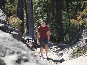 Liberal Leader Justin Trudeau in B.C. last year, hiking the Grouse Grind on the North Shore during his victorious federal election campaign. Now, as prime minister, his government faces a difficult West Coast environmental issue with the proposed Northern Gateway pipeline project across northern B.C.