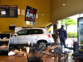 A silver SUV rests in Nature's Fare Market in Langley on May 13, 2013 after crashing through the front window and injuring several people, including former Playboy model Elaine Margaret Starchuk. Monique Tamminga/Langley Times files