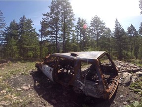 A burned-out car used for shooting practice on Gillard Forest Service Road in the Okanagan.