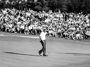 Arnold Palmer tips his hat to the gallery of patrons on the 18th green during the 1958 Masters Tournament at Augusta National Golf Club held April 3-6, 1958 in Augusta, Georgia.
