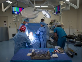 A male patient is prepped to have a cyst removed from his right knee at the privately operated Cambie Surgery Centre.