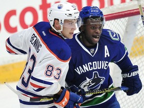 Vancouver Canucks' Jordan Subban (67) has his eye on the puck next to  Edmonton Oilers' Matt Benning (83) during first period 2016 NHL Young Stars Classic action at the South Okanagan Events Centre in Penticton, BC., September 16, 2016.