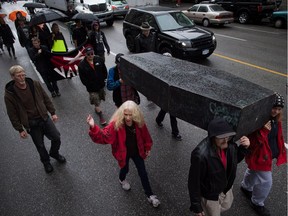The B.C. government will create a first-of-kind substance use research facility in wake of overdose crisis in city's Downtown Eastside. People carry a coffin to remember friends, family and community members who died as a result of overdoses, during a procession to mark Overdose Awareness Day in the Downtown Eastside of Vancouver, B.C., on Wednesday August 31, 2016.